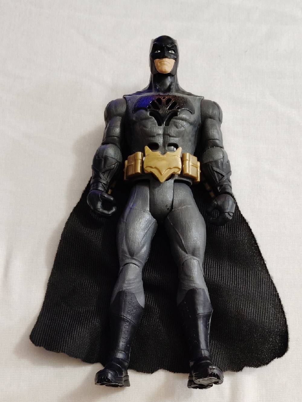 Black and Gray Superhero Action Figure with Gold Belt